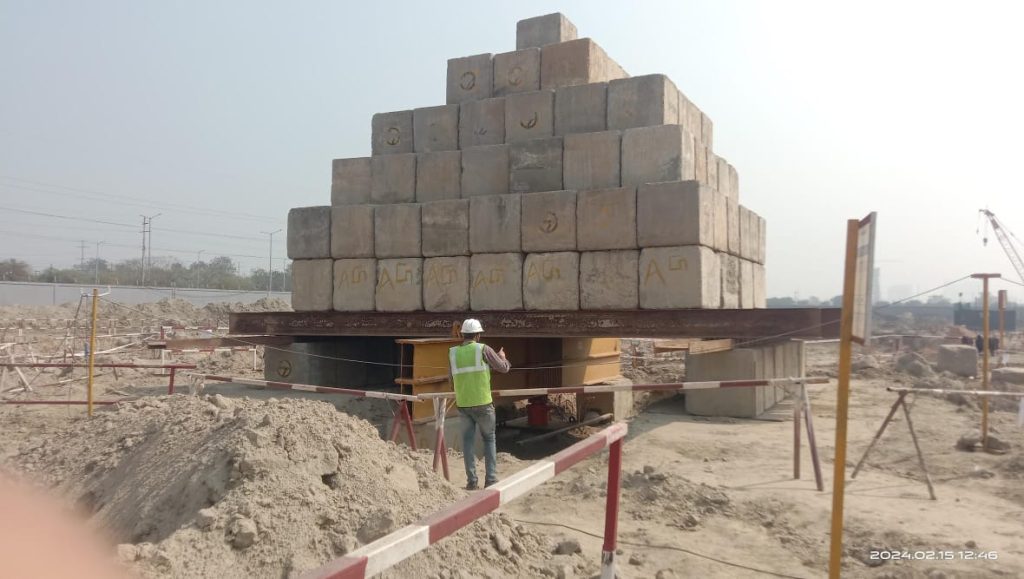 Pile load testing at construction site in Sonipat for foundation strength verification